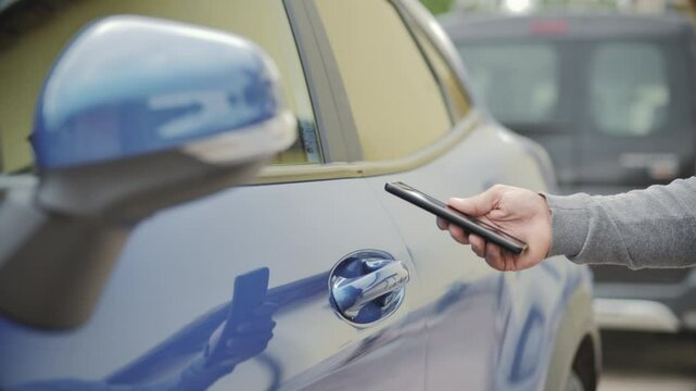 opening car door with mobile smartphone application at night,keyless system on smart phone app