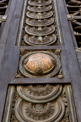 Details of the ornate front door metal grate of the Banca D&rsquo;Italia building, Milan