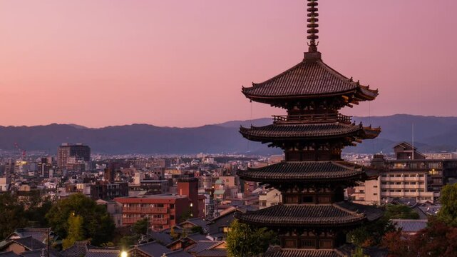 kyoto city skyline timelapse from day to night traditional temple pagoda hokan ji or yasaka tower, Higashiyama-ku district in the background