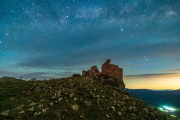 The strange rocks on the mountain are under the stars