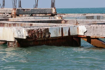 old building structure with rusty iron buildings in the sea