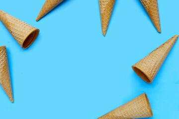 Waffle cones on blue background