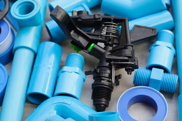 Plumber equipment with blue pvc pipe connections for plumbing work.