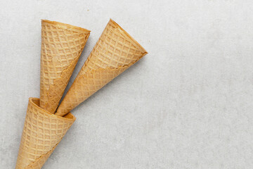 Waffle cones on grey background