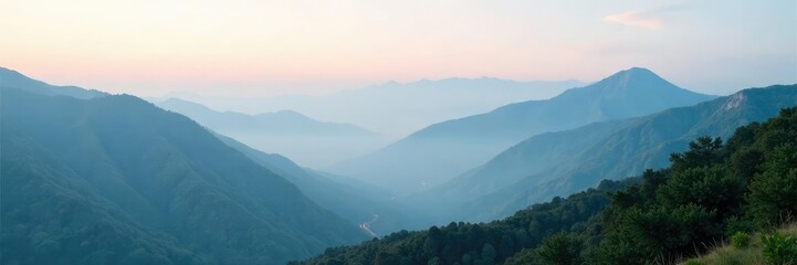 Fototapeta premium A mist-shrouded mountain range stretches into the distance, natural, terrain