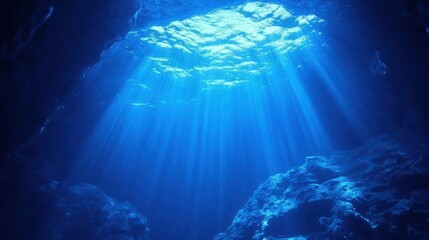 Serene Underwater Scene with Bright Sunlight Filtering Through the Ocean Surface, Illuminating Crystal Clear Water and Rocky Ocean Floor