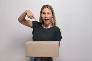 Excited Female Indicating the Box with a Shocked Expression