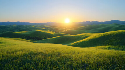 Obraz premium A beautiful sunset over a mountain range with a field of tall grass. The sky is a mix of orange and blue hues, creating a serene and peaceful atmosphere. The sun is setting behind the mountains