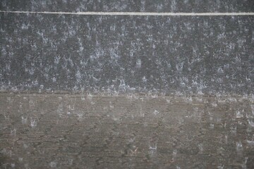 heavy rain falls on the street and bursts into crowns