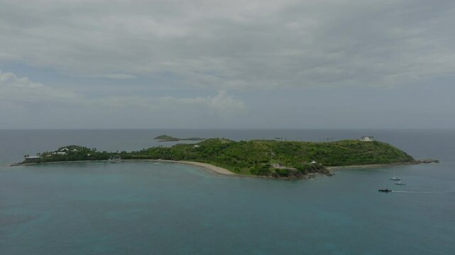 Aerial Forward Shot Of Motorboats Moving Around Epstein Island In Sea - VI, 
Little Saint James, United States of America