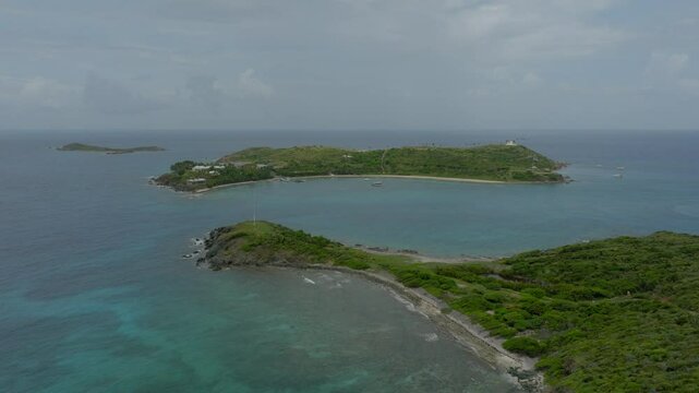 Aerial Scenic Shot Of Tranquil Epstein Island, Drone Flying Forward Over Waves In Sea - VI, 
Little Saint James, United States of America