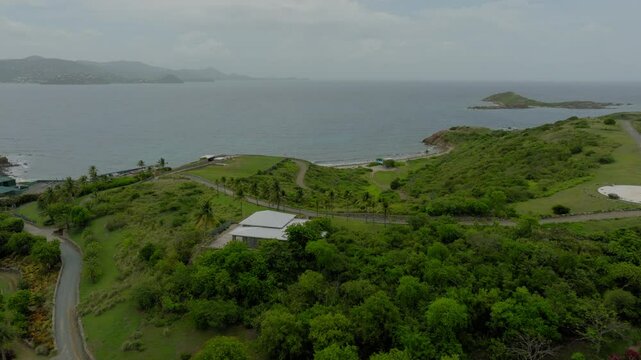 Aerial Forward Tranquil View Of Villa On Epstein Island Over Wavy Sea - VI, 
Little Saint James, United States of America