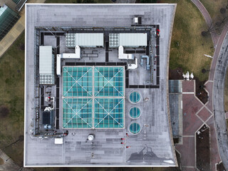 Commercial rooftop with blue glass windows and HVAC