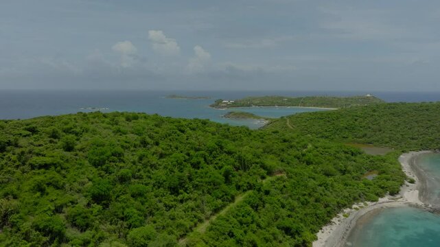 Aerial Panning Scenic View Of Tranquil Epstein Island, Drone Flying Over Green Trees On Sunny Day - VI, 
Little Saint James, United States of America