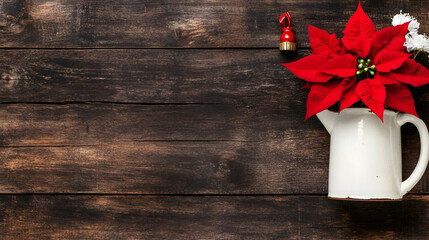 On a wooden table is a banner of a white vase with delicate white flower accents and bright red poinsettias. Christmas and winter themes