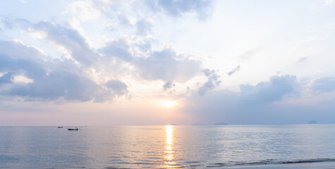Beautiful morning or evening blue and orange sky with cloudy while sunsets or sunrises was taken at the sea beach used as natural blackground texture