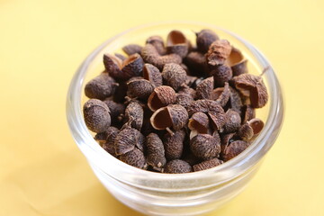 Sichuan pepper or Sichuanese pepper, Szechuan pepper, Chinese prickly ash, Chinese pepper, in a glass bowl