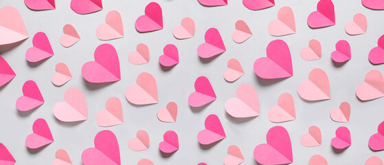 Composition with paper hearts on grey background. Valentine's Day celebration
