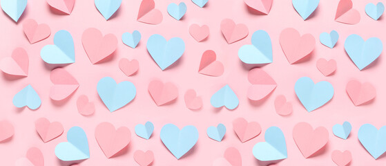 Paper hearts on pink background. St. Valentine's Day.