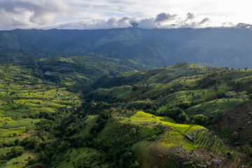Landscape of Morning Mist with Mountain Layer. mountain ridge and clouds in rural jungle bush forest