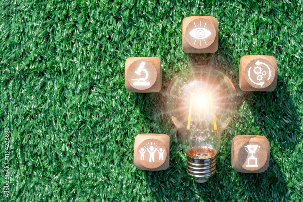 Poster innovative conceptual image with light bulb and icons on grass background representing creativity an