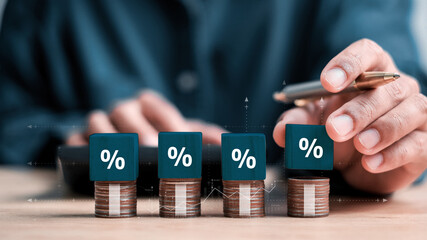 Interest rate and dividend concept, wooden block with percentage symbol and up arrow, return on stocks and mutual funds, long term investment for retirement.