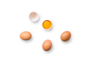 Closeup of brown organic free-range chicken eggs with broken egg isolated on a transparent background with shadow from above, top view
