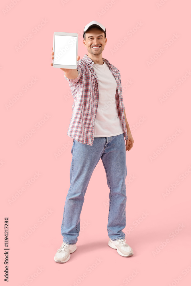 Poster man with tablet computer on pink background. mockup for design