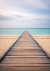 Fototapeta premium Tranquil seaside escape: wooden pier leading to turquoise waters under a cloudy sky