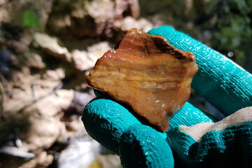 A specimen of bright red-brown flint picked up in a stream