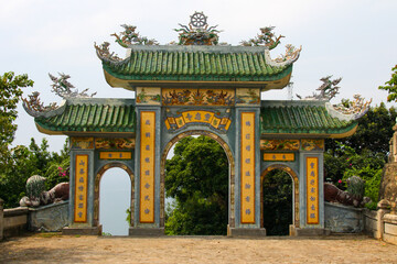 Fototapeta premium A traditional Buddhist arch way over looking the Vietnam Sea taken in the month of January 