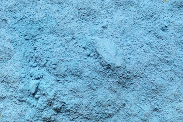 Blue powder pigment as background, closeup