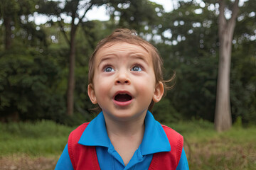 Child with a look of wonder, mouth slightly open in amazement