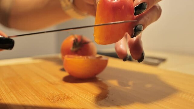 Detailed shot of tomato coring process - ripe vegetable and precise knife skills
