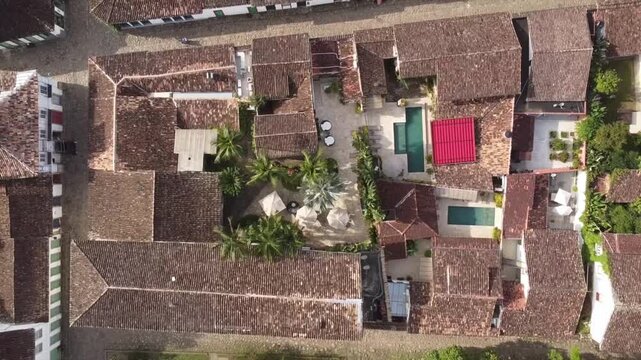 Aerial birdseye view of rooftops of colonial houses in historic center of Paraty, Brazil