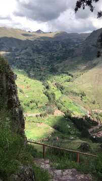 Sunlight illuminates agricultural terraces in the sacred valley, peru, seen from the pisac ruins