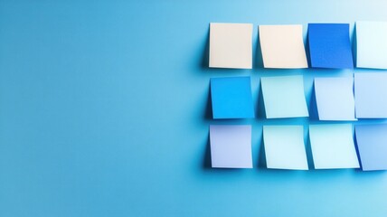 Blue sticky notes arranged on light blue background