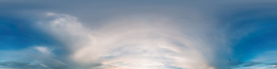 Obraz premium 360 panorama of glowing sunset sky with bright Cirrus clouds. Seamless hdr spherical 360 panorama. Sky dome in 3D visualization, sky replacement for aerial drone panoramas. Weather and climate change