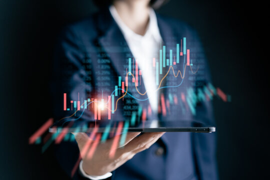 Businesswomen using a digital tablet analysis stock markets, uptrends, growth economics, business strategy development, and opportunities for investment, take profit from funds, Financial Analyst.