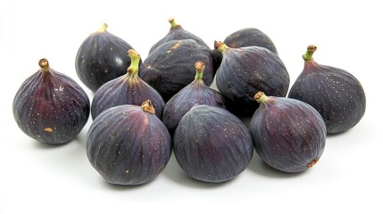 Fresh figs arranged in geometric formation on a white background showcasing their natural texture and rich color for culinary use.
