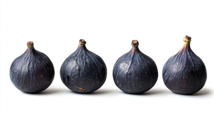 Fototapeta premium Fresh ripe black figs arranged in a row isolated on a clean white background showcasing their natural colors and textures for culinary use