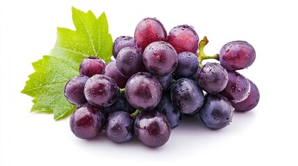 Obraz premium Bunch of fresh purple grapes with dew drops and green leaves on a white background showcasing natural fruits and healthy snacking options