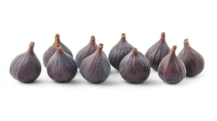 Fototapeta premium Fresh ripe figs arranged on a clean white background showcasing their unique shape and rich color for culinary and health-related uses