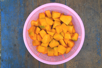 pumpkin in slices and pumpkin leaves. to make delicious pumpkin vegetables