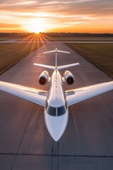 Fototapeta premium Sunset Departure: Private Jet on Runway at Golden Hour