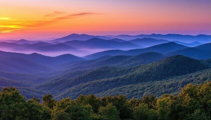 Obraz premium Serene mountain landscape at sunset with layered hills and vibrant colors.