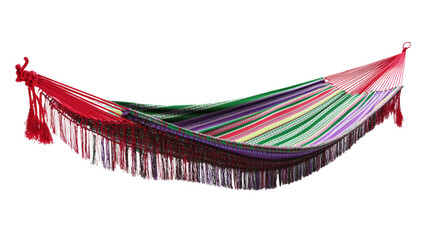 A vibrant multicolored striped hammock with red tassels hangs gently, suggesting relaxation and leisure.