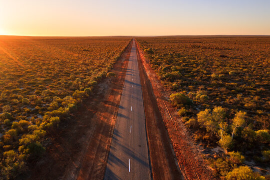 Aerial view of road in the outback at sunset, Western Australia