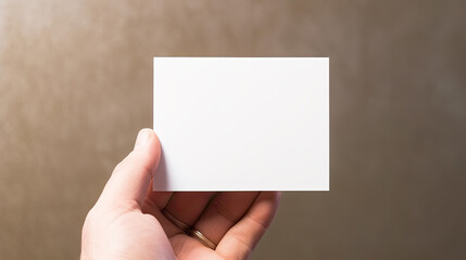 Fototapeta premium Hand Holding Blank White Card Mockup