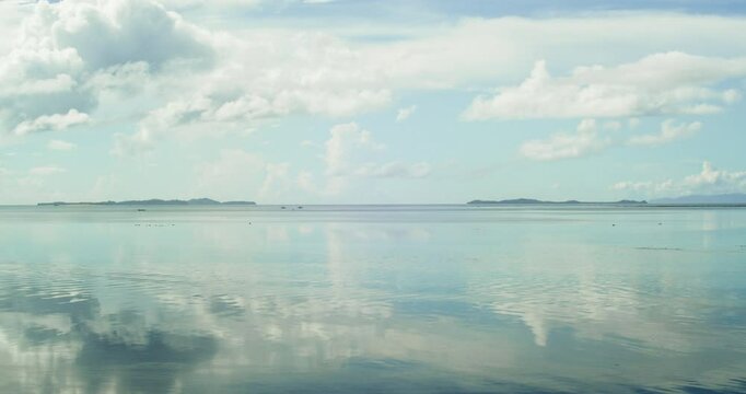 A time-lapse view of clear waters and busy fisher-folks from Secret Beach in Dapa, Siargao.
